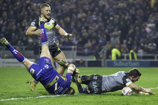 Wakefield's Danny Brough touches down for a try against Leeds Rhinos.