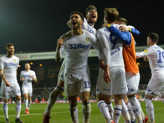 AWESOME: Leeds United's Tyler Roberts, centre, celebrates Patrick Bamford's second goal in Friday night's 4-0 win against West Brom at Elland Road.