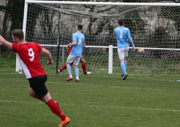 Adam Baker nets Knaresborough Town's winning goal against Barton Town. Picture: Craig Dinsdale.