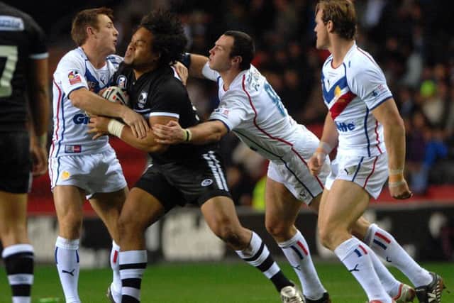 New Zealand's Epalahame Lauaki is tackled by Great Britain's James Roby (left) and Adrian Morley at Wigan back in 2007. Picture: Anna Gowthorpe/PA