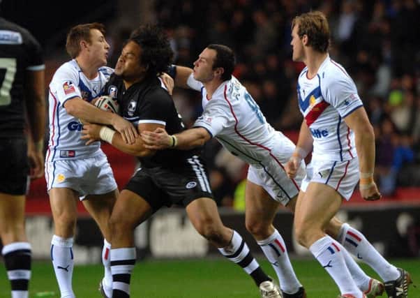 New Zealand's Epalahame Lauaki is tackled by Great Britain's James Roby (left) and Adrian Morley at Wigan back in 2007. Picture: Anna Gowthorpe/PA