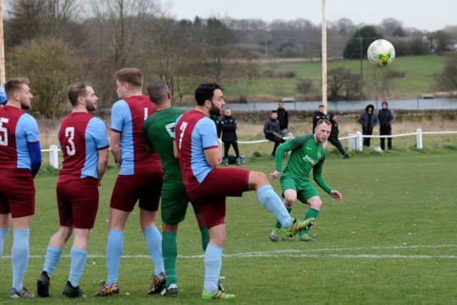 Dan Daly, of Beeston St Anthony's, scores the winner over Rawdon Old Boys. PIC: Steve Riding