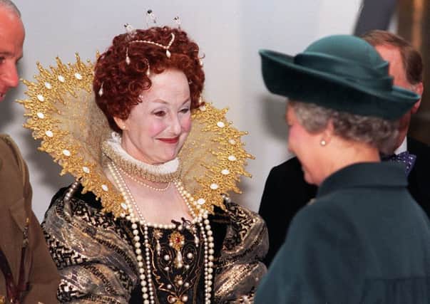 Una Stubbs, in a costume of Queen Elizabeth 1, meets Queen Elizabeth 2 during her visit to Leeds for the opening of The Royal Armouries on the 15th March 1996.