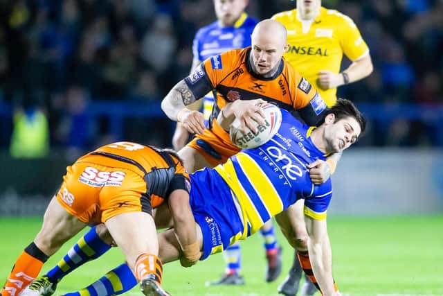Warrington Wolves' Jake Mamo is brought down by Castleford's Nathan Massey and Paul McShane. (Allan McKenzie/SWPix)