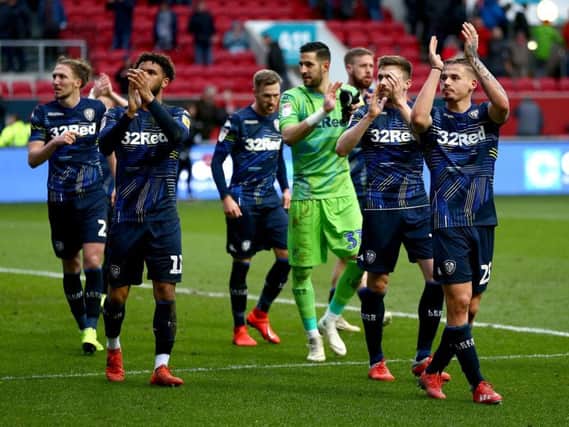 Leeds United's players celebrate following full-time at Ashton Gate.