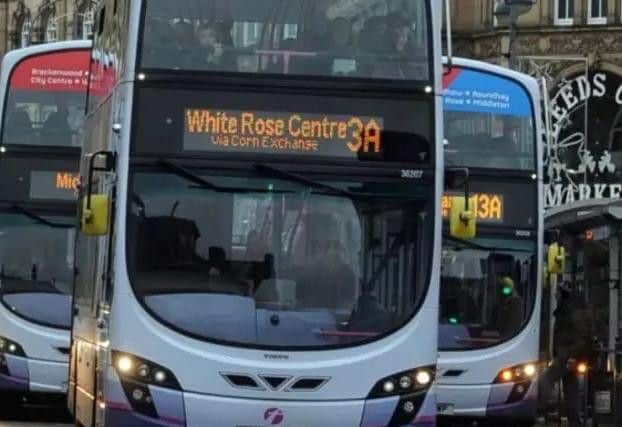 Buses on the streets of Leeds city centre.