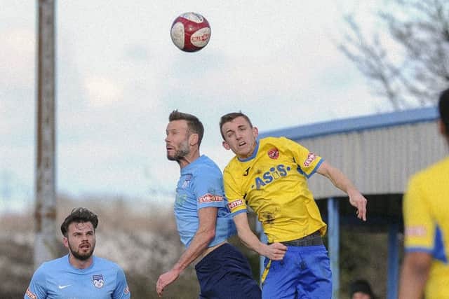 Ossett United's Andy Monkhouse contests a header during his side's 1-1 draw with AFC Mansfield. Picture: Scott Merrylees.