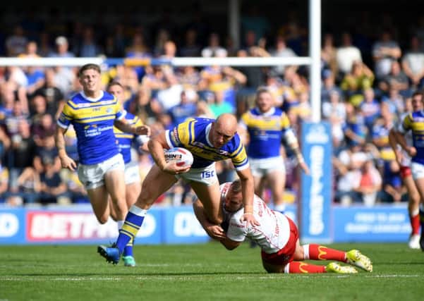 Leeds Rhinos' Carl Ablett is tackled by Hull KR's Adam Quinlan, in September last year. Picture: James Hardisty.