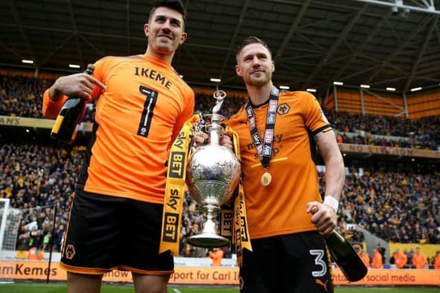 Leeds United left-back Barry Douglas, right, lifting the Championship title with Wolverhampton Wanderers last season. He was sold by Wolves before he could play in the Premier League.