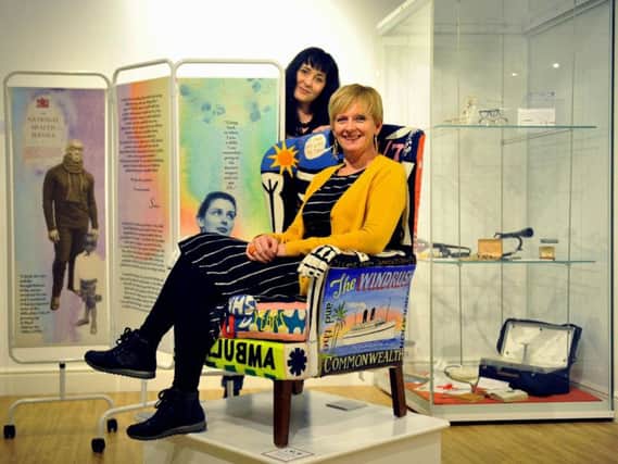 Artists Jelena Zindovic (left) and Jane Moorland with  an appliqued chair and  hospital screen which showcases peoples stories of the NHS part of a new ecxhibition at the Thackray Medfical Museum in Leeds.
