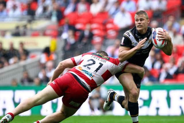 Jacob Miller tries to go past Wigan Warriors' Scott Taylor when playing for Hull FC in the 2013 Challenge Cup final. (SWPix)