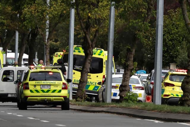 Ambulances parked outside a mosque in central Christchurch, New Zealand, Friday, March 15, 2019. Many people were killed in a mass shooting at a mosque in the New Zealand city of Christchurch on Friday, a witness said. Police have not yet described the scale of the shooting but urged people in central Christchurch to stay indoors. (AP Photo/Mark Baker)