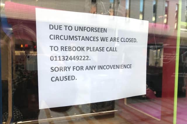 The sign currently in the window of the Kitty Cafe