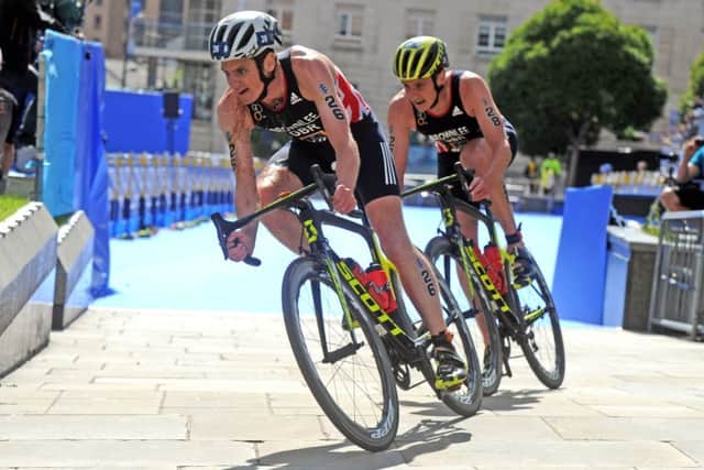 FOLLOW ME LEADER: Jonny Brownlee leads his brother Alistair on the bike in the Elite Mens Race through Millennium Square back in 2017. Picture: Tony Johnson.