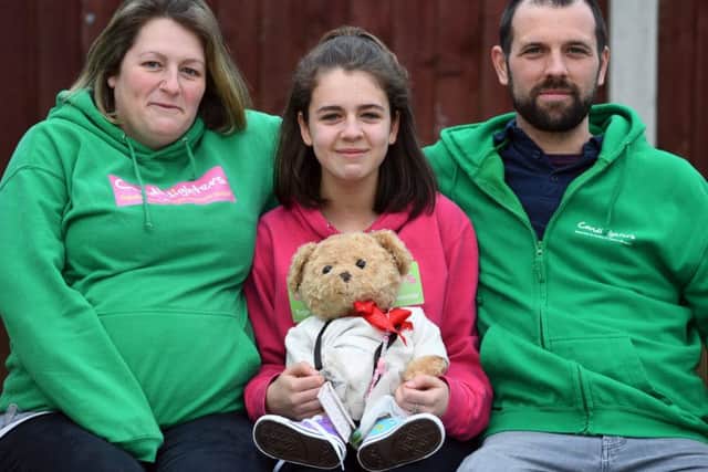 Chloe Thompson, from Old Farnley, Leeds who is fundraising in memory of her sister, Summer, a leukaemia sufferer who died aged two in 2017. Pictured with her parents Gareth and Becky.