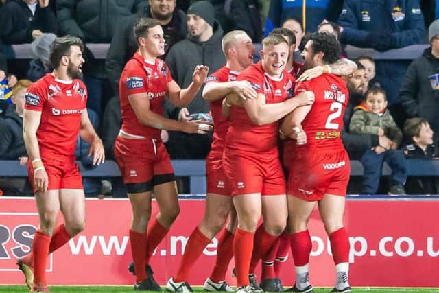 London Broncos players celebrate Jay PItts' try against Leeds.