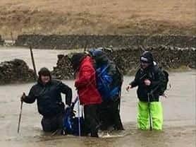The group trying to cross the flooded River Ribble
