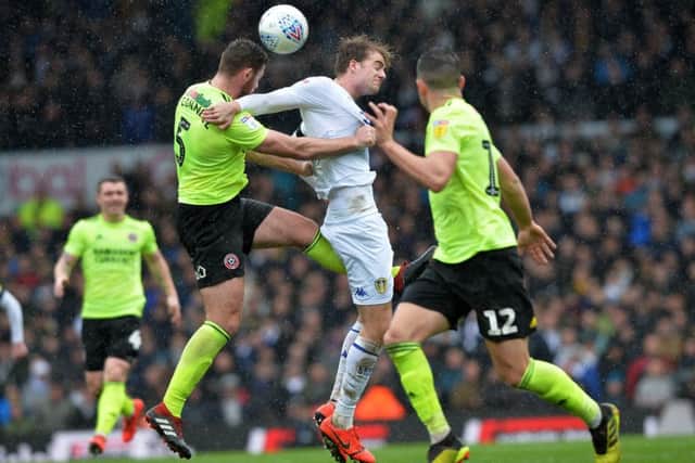 Jack O'Connell and Patrick Bamford challenge for a high ball.
Picture: Bruce Rollinson.