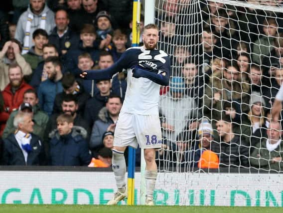 UNLIKELY SIGHT: Leeds United centre-back Pontus Jansson pulls on Kiko Casilla's goalkeeping jersey to take his place in net after the Spaniard's sending off.