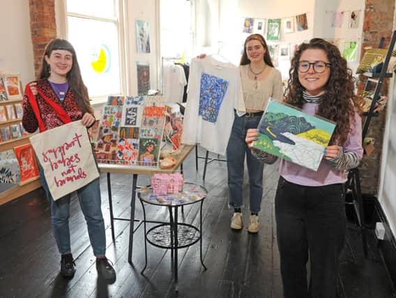 Art students Megan Whalen, River Blue Wild and Esme Rose Marshall at Find&SeeK,  a Leeds Art University student collaboration project - a pop up shop at Leeds Corn Exchange. Picture Tony Johnson.