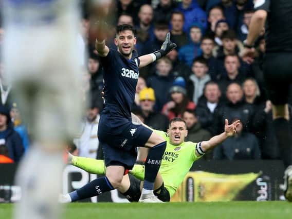 Kiko Casilla brings down Billy Sharp during Leeds United's defeat to Sheffield United.