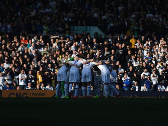 Leeds United players huddle at Elland Road.