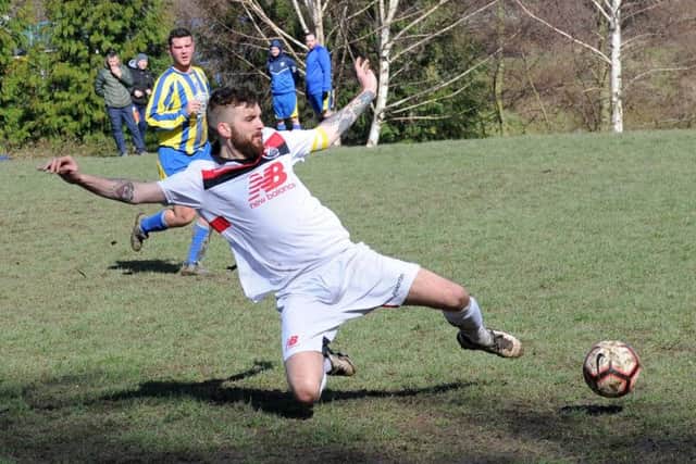 Joel Deacey slides in but his shot is wide of the mark in Bardsey's 5-4 win at Crown & Anchor. PIC: Steve Riding