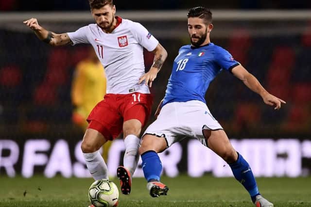 Leeds United midfielder Mateusz Klich in action for Poland against Italy.