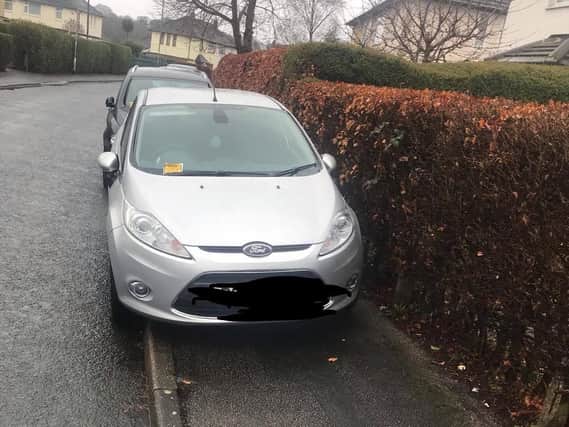 A car parking on the pavement Tynwald Road in Moor Allerton.