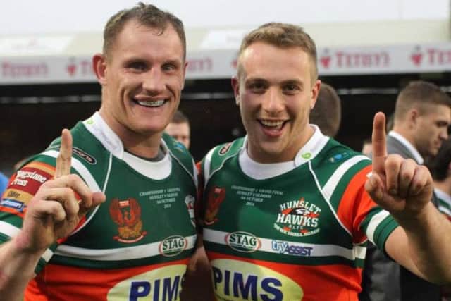 Moore (left) celebrates winning the Championship 1 Grand Final with Hunslet in 2014.