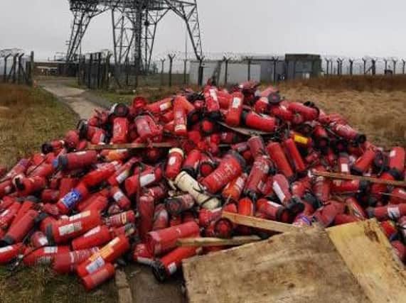 The huge pile of fire extinguishers dumped on Windy Hill