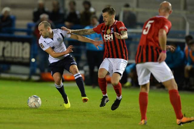 Guiseley's Will Hatfield, left.