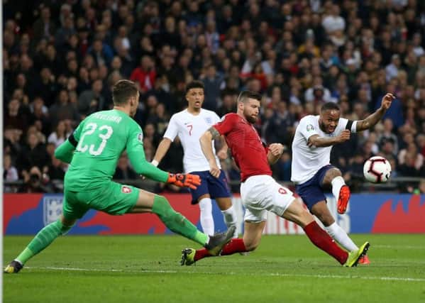 Hat-trick hero: England's Raheem Sterling scores his side's third goal at Wembley.