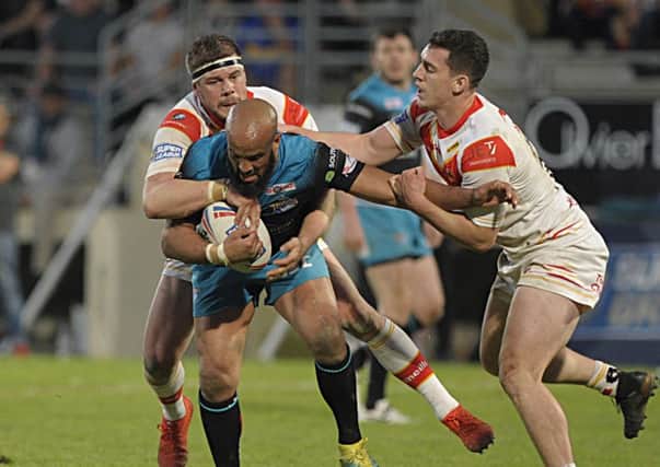 NO WAY THROUGH: Jamie Jones Buchanan is wrapped up by the Catalans defence. Picture: Pascal Rodriguez/RLphotos.com