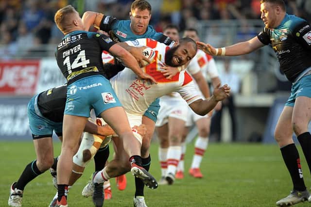CLOSING IN: Leeds Rhinos get to grips with Catalans new signing Sam Kasiano. Picture: Pascal Rodriguez