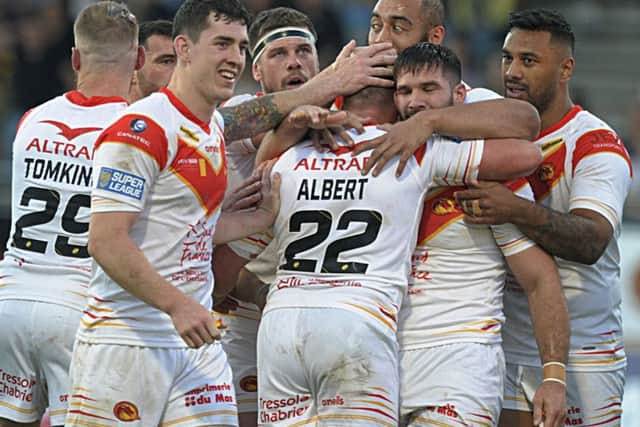 Catalans celebrate at the end of the game against Leeds Rhinos. Picture: Pascal Rodriguez.