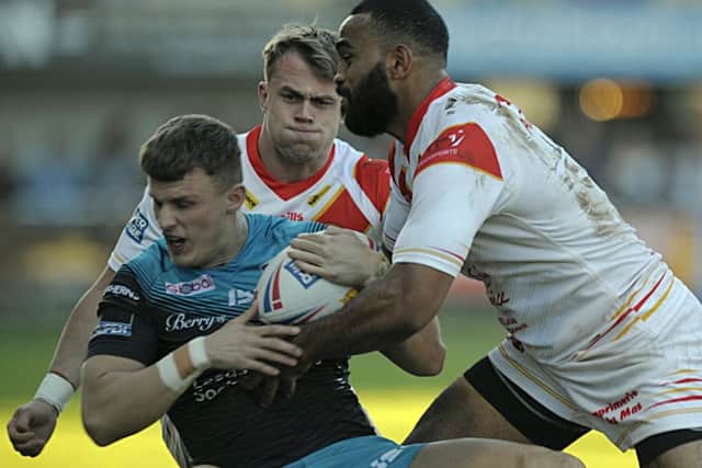 BOUNCING BACK: Ash Handley is taken down by the Catalans defence. Picture: Pascal Rodriguez/RLPhotos.com