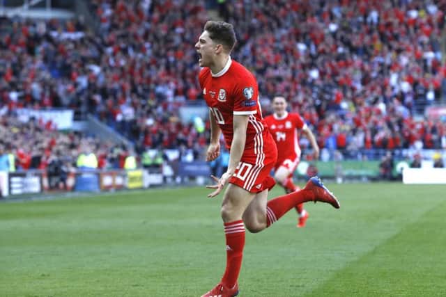 Wales' Daniel James celebrates scoring.