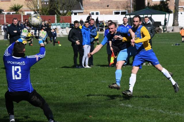HT Sports' Steven Palfrey fends off Andrew Gallagher to get a shot off.
PIC: Jonathan Gawthorpe