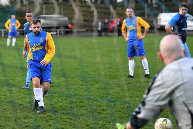 Hope Inn's Kingsley Wetherald slots his penalty past Ross Monaghan, the HT goalkeeper,to make it 3-1. PIC: Jonathan Gawthorpe