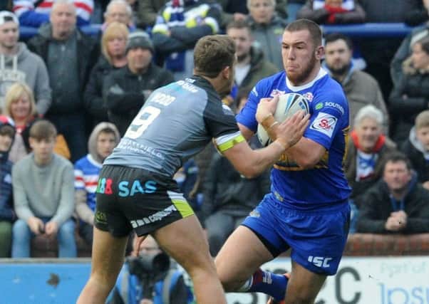 Leeds Rhinos' Cameron Smith takes on Wakefield's Kyle Wood