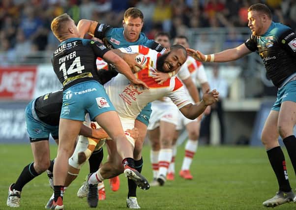 Catalans Dragons' new signing Sam Kasiano takes on the Leeds Rhinos' defence.
