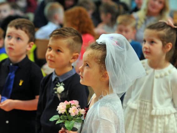 Nursery and reception pupils from Drighlington Primary School take part in a mock wedding at St Paul's Church, with Bride Kelissi Lister-Kemp and groom Blake Green taking the staring roles. Picture Tony Johnson.
