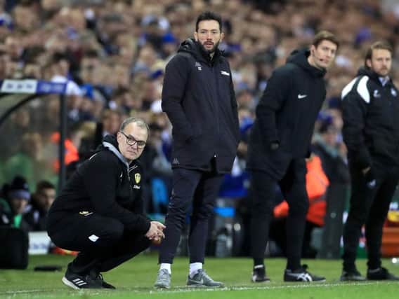 Carlos Corberan, centre, on the touchline with Marcelo Bielsa during Leeds United's win over Swansea City in February.