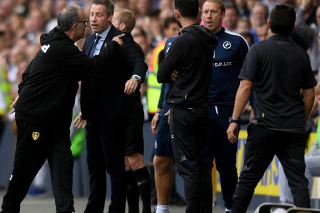 Leeds United head coach Marcelo Bielsa and Millwall boss Neil Harris.
