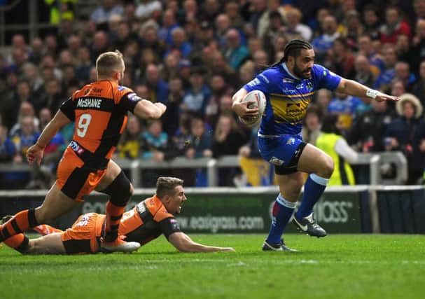 Konrad Hurrell gets away from Tigers' Greg Minikin to go on and score the opening try.