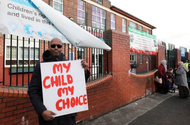 Parents and pupils stage protest outside Parkfield community school Saltley, Birmingham, demanding LGBT lessons are banned.  March 7, 2019.  See SWNS story SWMDprotest.  A school which has suspended lessons about LGBT rights and homophobia following protests from parents has denied the move is a U-turn.  Parkfield Community School in Alum Rock, Birmingham, has seen protests over its No Outsiders project.  It said it was always the plan for the classes to stop at half-term.  But, it added, there is a need for discussions between teachers and parents about the curriculum and how it should be delivered in the future.