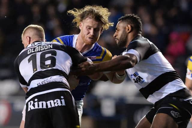 Wellington Albert (right) and Widnes Vikings teammate Tom Olbison tackle Leeds' Anthony Mullally in a Challenge Cup tie last year. Picture Bruce Rollinson