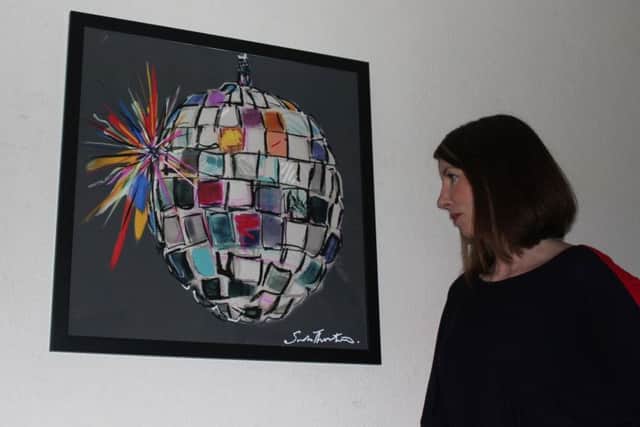 Sarah Thornton with her Disco Ball painting