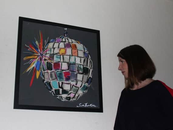 Sarah Thornton with her Disco Ball painting